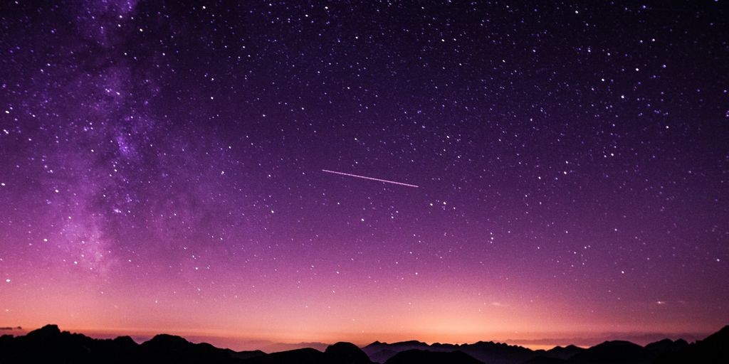 silhouette photo of mountain during night time