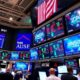 Traders celebrate on a lively stock exchange floor.