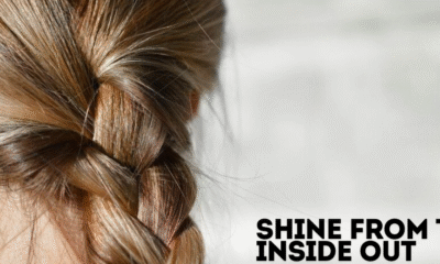 Assorted hair skin and nail vitamins in a hand