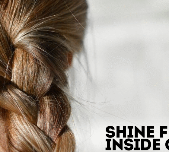 Assorted hair skin and nail vitamins in a hand