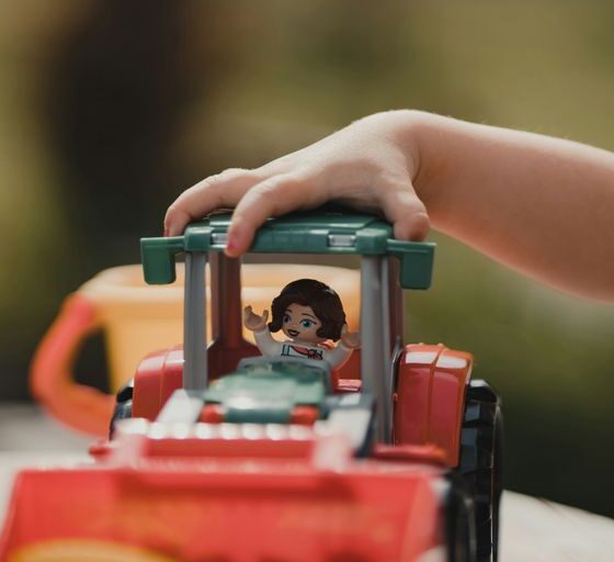 a small child playing with a toy truck