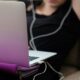 woman sitting on sofa with MacBook Air