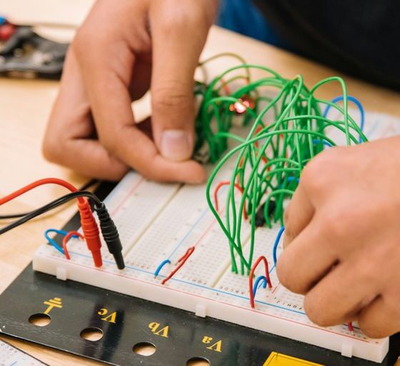person holding black and white audio mixer
