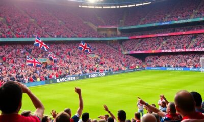 Fans cheering during an English Premier League match.