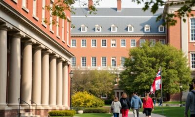 Harvard University campus with students and international flags.