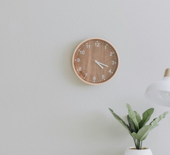 white desk lamp beside green plant