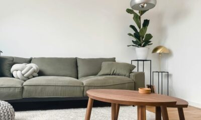 gray 2 seat sofa near brown wooden coffee table