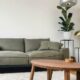 gray 2 seat sofa near brown wooden coffee table