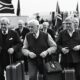 Group of white Afrikaners arriving at an airport.