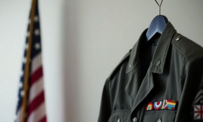 Military uniform with insignia and American flag background.