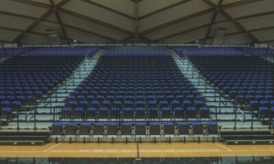 a basketball court with rows of empty seats
