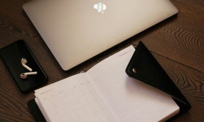 silver macbook beside black iphone 5