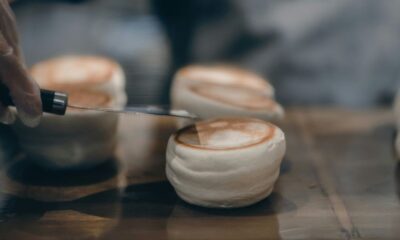 a person with a knife cutting into some food