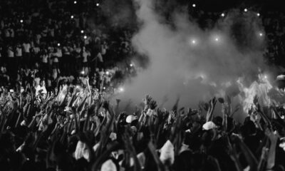 a black and white photo of a crowd at a concert