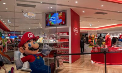 a nintendo store with mario running through the store