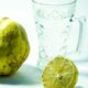 yellow lemon beside clear glass mug