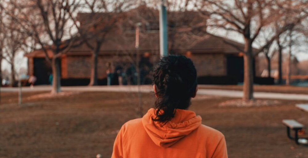 a person standing in front of a basketball hoop