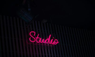 a neon sign that reads studio on the side of a building