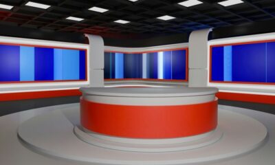 This is an empty modern news studio set.