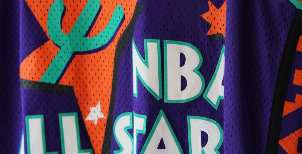 a close up of a basketball jersey with a cactus on it