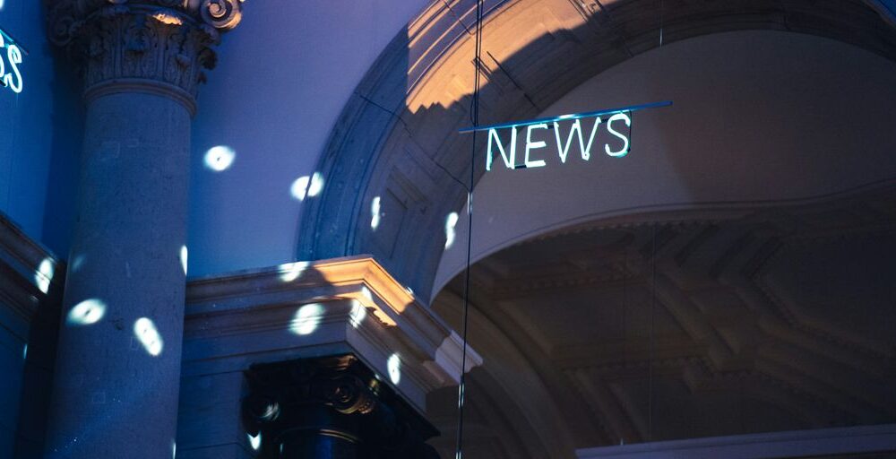 a building with a sign on the roof