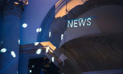 a building with a sign on the roof