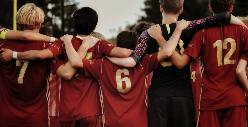 boys in red jersey shirts