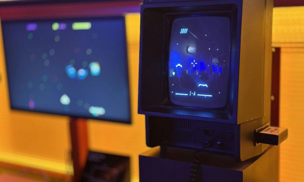 a small tv sitting on top of a wooden stand