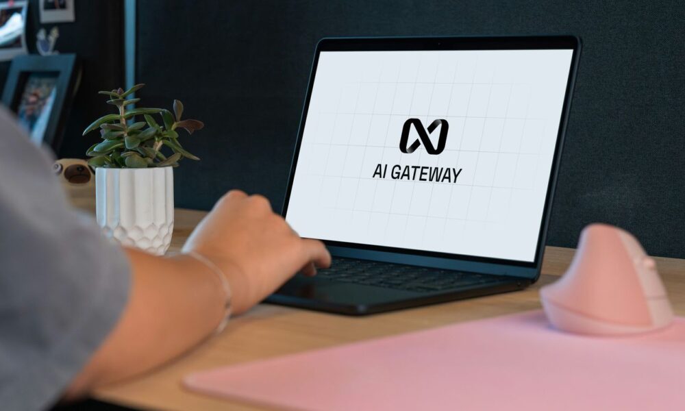 Person typing on laptop with "ai gateway" logo.