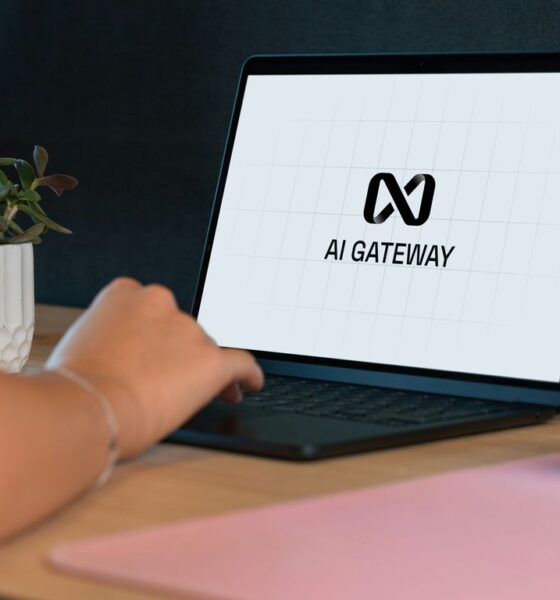 Person typing on laptop with "ai gateway" logo.