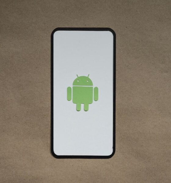 a cell phone with a green icon on it