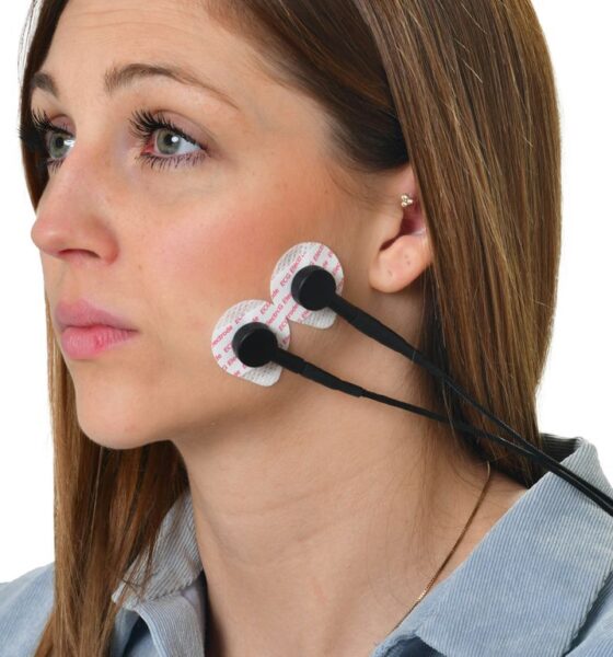 a woman wearing a pair of ear buds