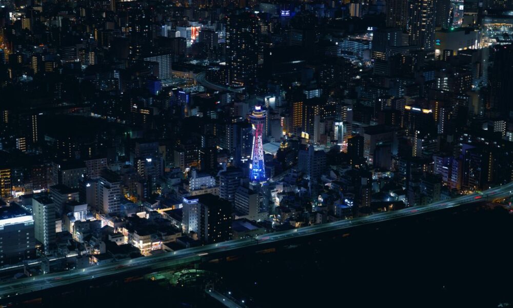 Aerial view of a city skyline at night.