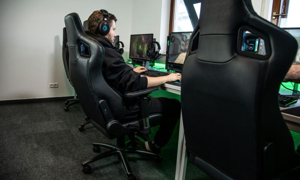 woman in black jacket sitting on black office rolling chair
