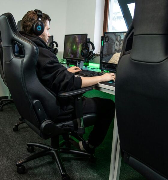woman in black jacket sitting on black office rolling chair