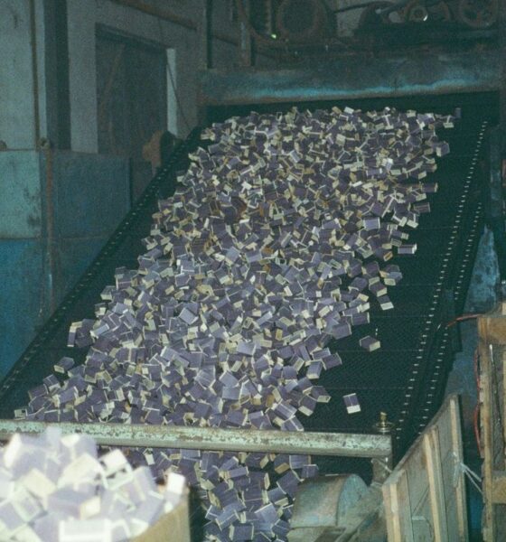 a conveyor belt filled with lots of money