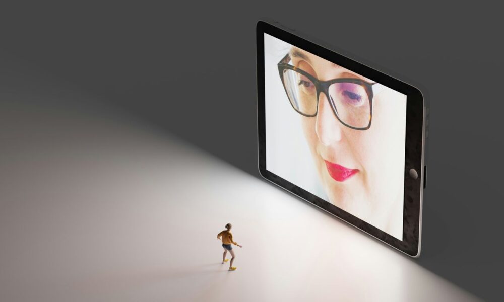 black framed eyeglasses on white table