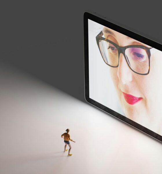black framed eyeglasses on white table
